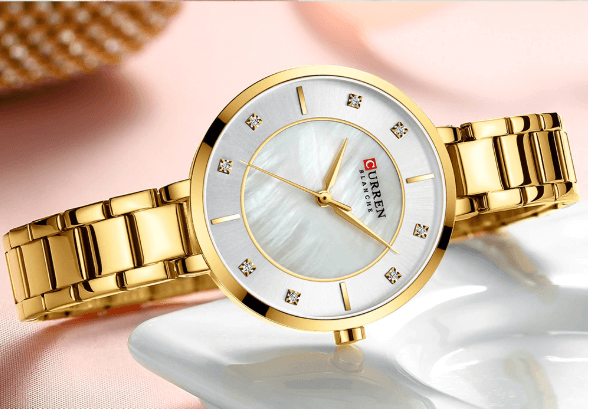 ELITE CASA Riveting Women’s Luxury Watch on a white surface with a golden strap and a mother-of-pearl dial.