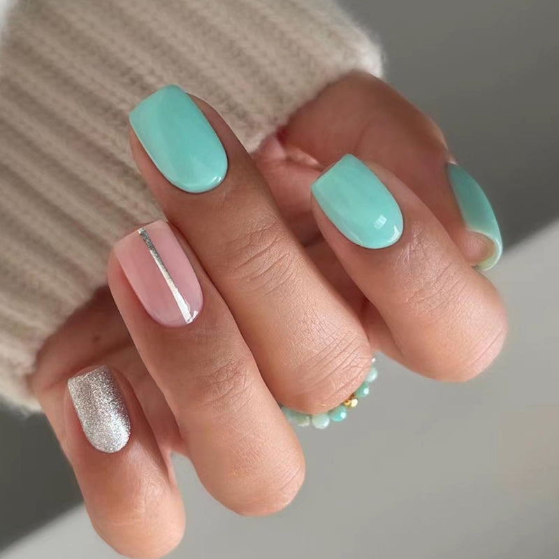 ELITE CASA Reusable Press On Nails Kit with Glue featuring colorful nail designs in mint and pink tones.