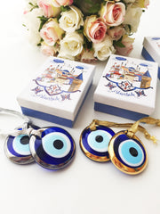 ELITE CASA Christmas gift ideas featuring blue evil eye charm in decorative boxes.
